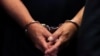 U.S. -- Former Trump campaign chairman Paul Manafort's hands are shown in handcuffs as he is escorted into court during before his arraignment in New York Supreme Court in New York, U.S., June 27, 2019